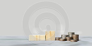 Rows of coins on wooden cubes, Financial business investment, Growing money, Money saving and financial banking