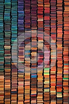 rows of colorful books forming a repeating pattern