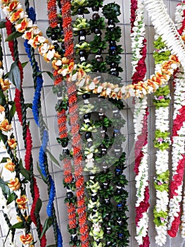 Rows of Colorful Hawaiian flower lei for sale