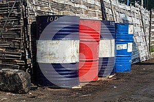 rows of colorful iron barrels for storing fuel and oil