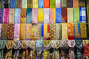 Rows of colourful silk scarfs