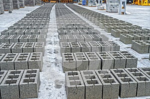 Rows of concrete cinder blocks, building material in form of gray bricks. Use on construction site.