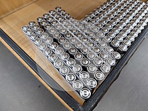 Rows of cylindrical batteries on a table