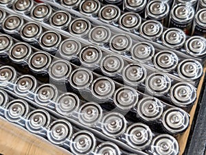 Rows of cylindrical batteries on a table