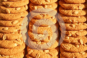 Rows of delicious round cookies with nuts