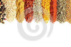 Rows of different aromatic spices on white background