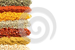 Rows of different aromatic spices on white background