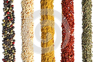 Rows of different aromatic spices on white background