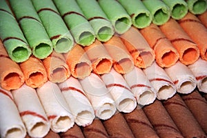 Rows of different color egg rolls