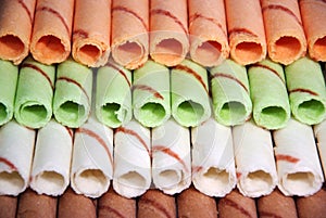 Rows of different color egg rolls