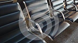 Rows of empty chairs in an airport lounge