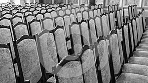 Rows of empty chairs in the auditorium