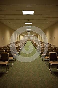 rows of empty chairs in a conference room