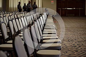 rows of empty chairs cordoned off, security personnel standing by