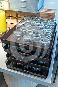 Rows of empty glass plastic tray over counter