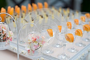 Rows of empty glasses prepared for reception