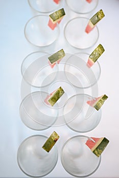 Rows of empty glasses prepared for reception