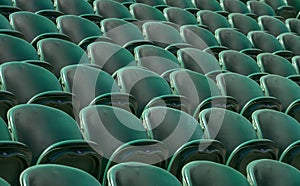 Rows of empty green spectators` seats at Wimbledon All England Lawn Tennis Club.