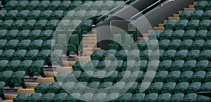 Rows of empty green spectators` seats at Wimbledon All England Lawn Tennis Club.