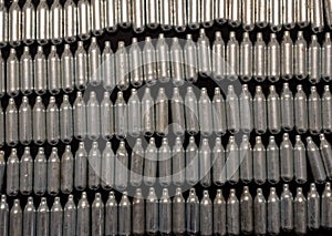 Rows of empty laughing gas cannisters / cream puff chargers: used as a legal high