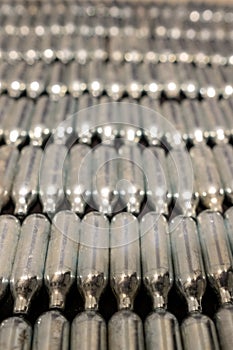 Rows of empty nitrous oxide cannisters / cream puff chargers: used as a legal high