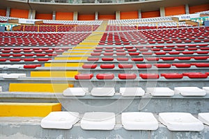 Rows of empty orange and white seats in the sports complex of the Estadio Nacional - Soccer Stadium - in Lima Peru