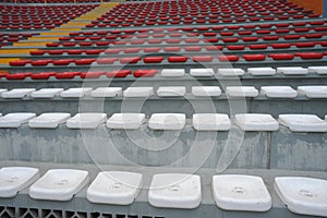 Rows of empty orange and white seats in the sports complex of the Estadio Nacional - Soccer Stadium - in Lima Peru photo