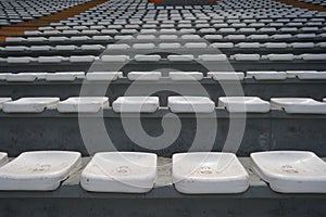 Rows of empty orange and white seats in the sports complex of the Estadio Nacional - Soccer Stadium - in Lima Peru photo