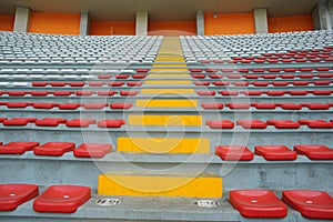 Rows of empty orange and white seats in the sports complex of the Estadio Nacional - Soccer Stadium - in Lima Peru photo