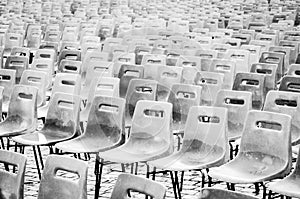 Rows of empty plastic chairs