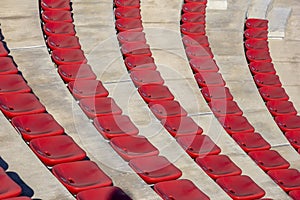 Rows of empty plastic red chairs