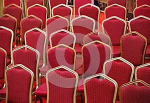 Rows of empty red seats in theater hall