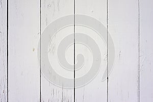 Rows of a fence with whitewashed pine boards