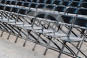 Rows of folding chairs, empty seats ion event - chair row