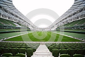 Rows of green seats in an empty stadium