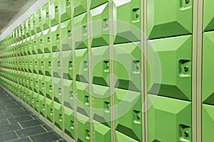Rows of green student lockers in school hall