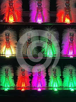 Rows of hairy red, purple, and green lit clown pin arcade game