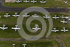 Rows Of light Planes At A Regional Airport Awaiting Next Scheduled Flight photo