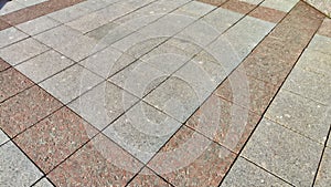 Rows and lines of square sidewalk gray tiles on the floor outside or indoors. Street path. Abstract background, texture