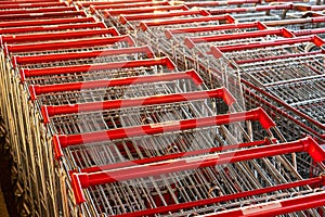 Rows with lots of shopping carts in a large supermarket