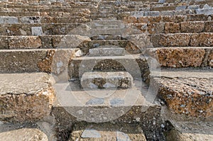 Rows of marble stone seats at ancient Greek theater at Ephesus