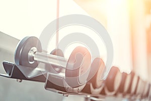 Rows of Metal Dumbbells on Rack in the Gym