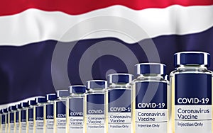 Rows of multiple Covid-19 vaccine vials with flag of Thailand in background. Mass production and inoculation concept. 3d rendering