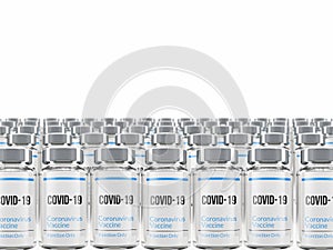 Rows of multiple Covid-19 vaccine vials isolated on a white background.