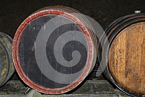 Rows of oak wood wine barrels in winery cellar