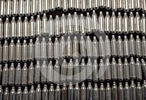 Rows of empty nitrous oxide cannisters / cream puff chargers: used as a legal high