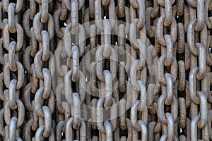 Rows of old rusty metal chains as a background