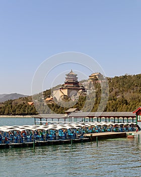 Rows of pedaling boats in Kunming lake of Summer palace in Beijing, China