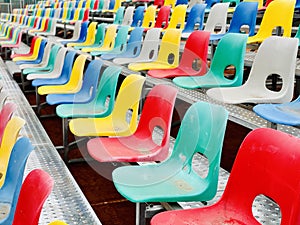 Rows of plastic colorful seats at a stadium