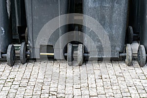 Rows of plastic recycle wheelie bins